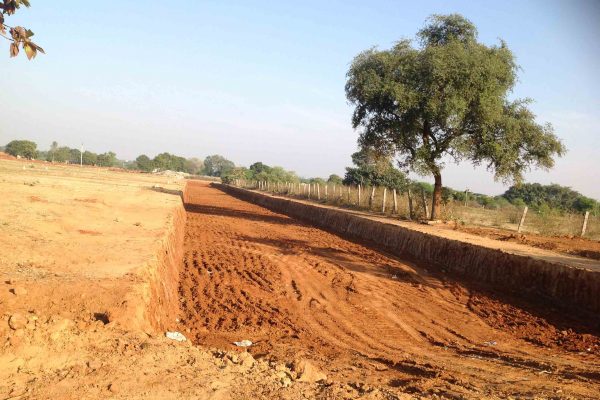 Roads being laid by scooping up 5 feet of Earth.